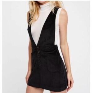 Free people velvet corduroy black overall dress. Can go with a white turtleneck.